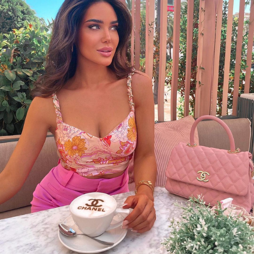 Coffee printer: Chanel logo on latte, purse on a terrace table